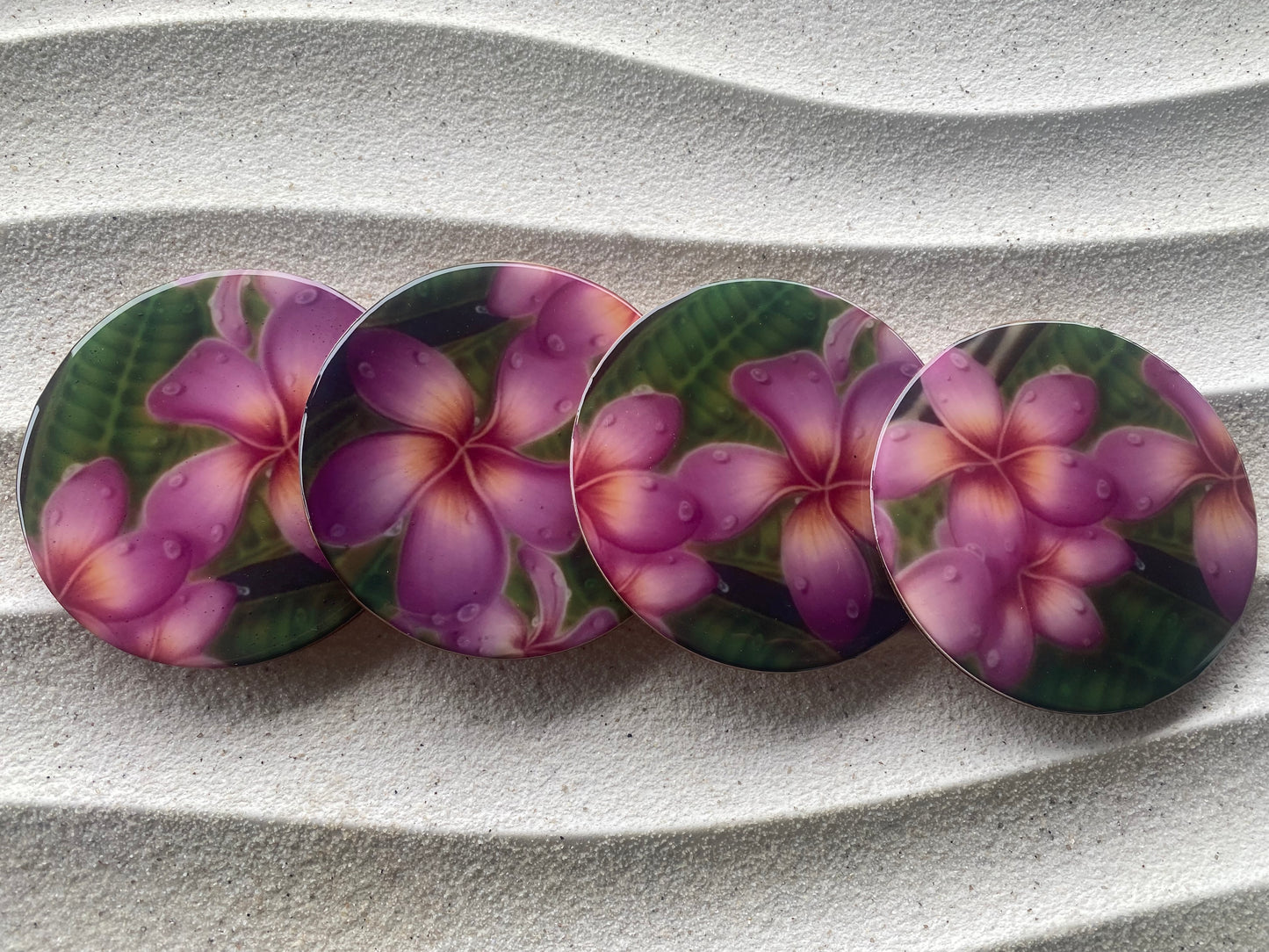 Plumeria print wood coasters with cork bottom. Set of 4 matching
