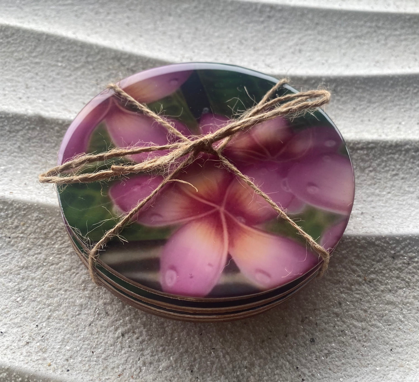 Plumeria print wood coasters with cork bottom. Set of 4 matching